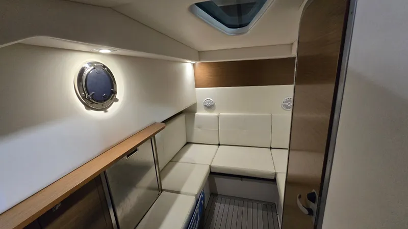 Slide: The Image of Interior of 2017 Cruisers Yachts 338CX with seating area. - 22