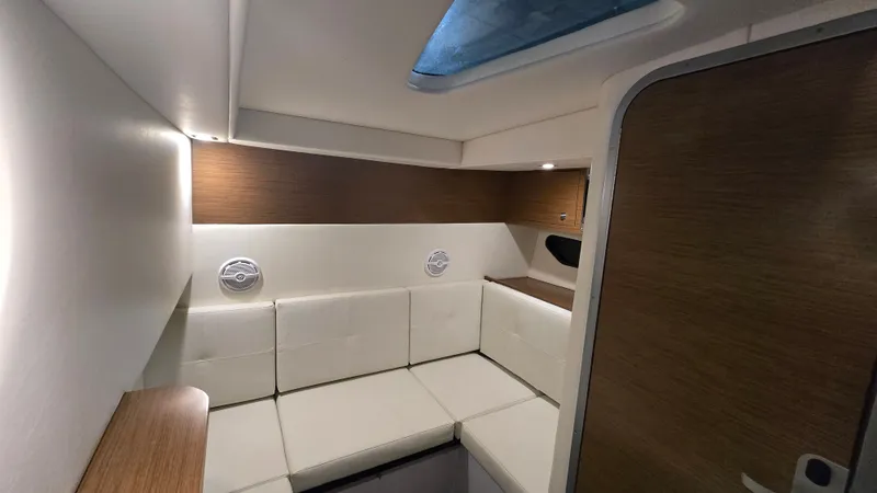 Slide: The Image of Interior of 2017 Cruisers Yachts 338CX with white upholstery. - 23