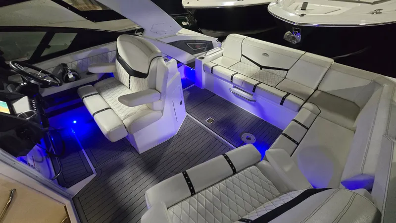 Slide: The Image of Interior of a 2017 Cruisers Yachts 338CX with blue LED lighting. - 4