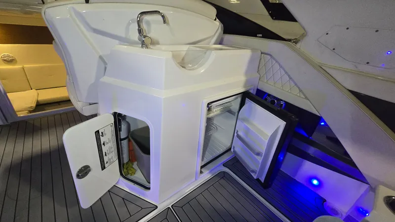 Slide: The Image of Interior of 2017 Cruisers Yachts 338CX with fridge and sink. - 8