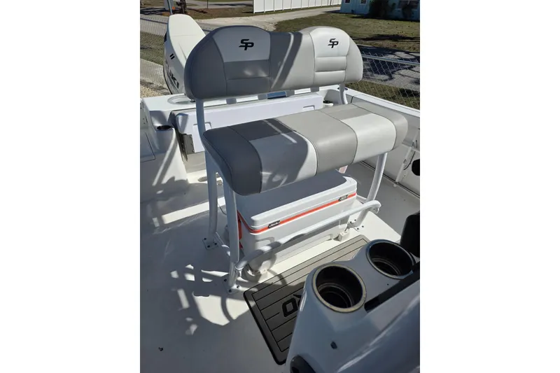 Slide: The Image of 2018 Sea Pro 219 Center Console boat seating with integrated cooler and cup holders. - 12