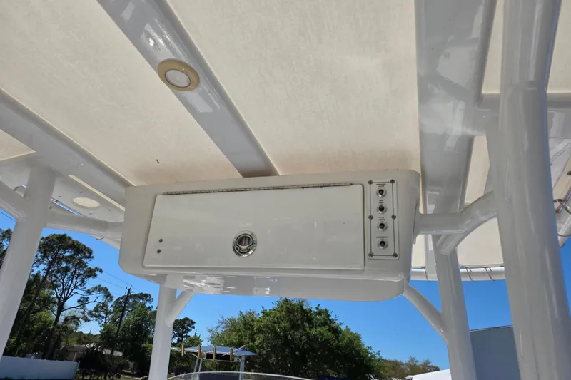 Slide: The Image of 2018 Sea Pro 219 Center Console boat's overhead console and controls. - 14