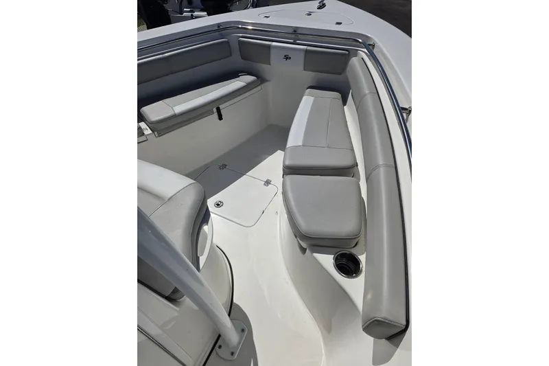 Slide: The Image of 2018 Sea Pro 219 Center Console boat interior with cushioned seating and storage. - 15