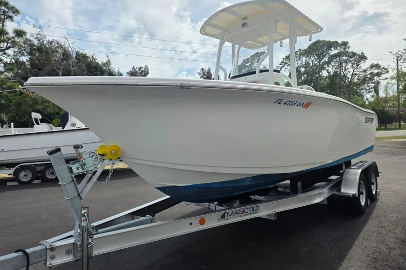 Slide: The Image of 2018 Sea Pro 219 Center Console boat on trailer, parked outdoors. - 5