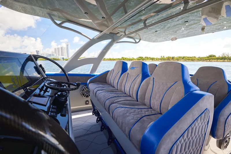 Slide: The Image of Luxurious interior of 2023 Midnight Express 43 Solstice yacht with plush seating and modern controls. - 15