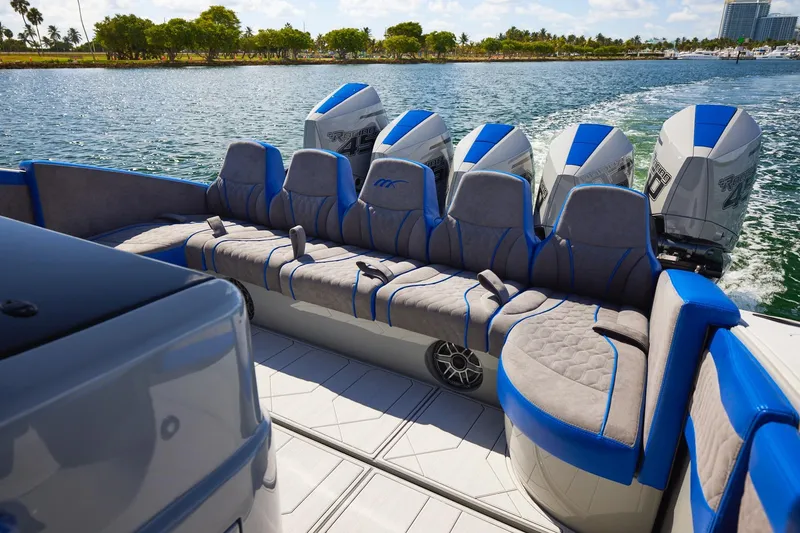 Slide: The Image of 2023 Midnight Express 43 Solstice boat interior with plush seating and powerful engines. - 19