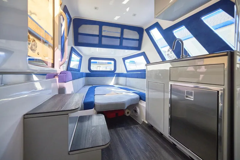 Slide: The Image of Luxurious interior of 2023 Midnight Express 43 Solstice boat with modern kitchen and seating area. - 20