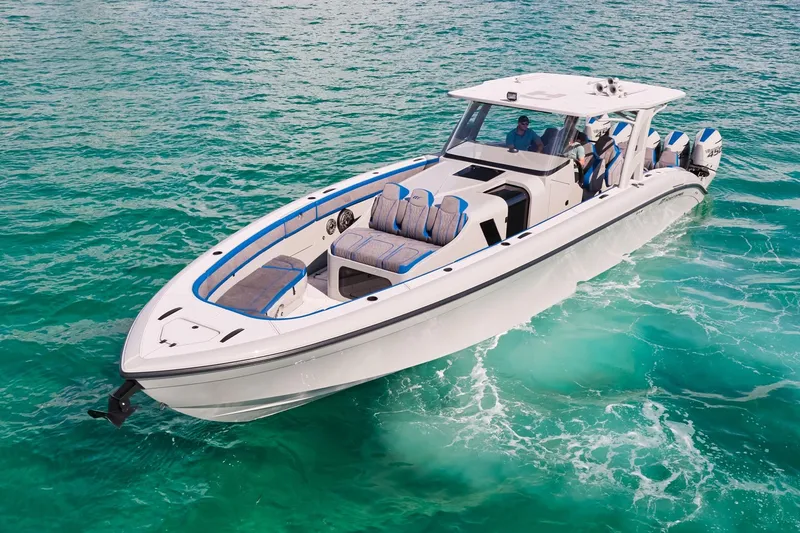 Slide: The Image of 2023 Midnight Express 43 Solstice boat cruising on clear turquoise water. - 6