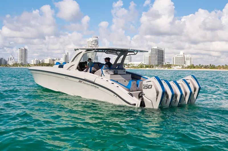 Slide: The Image of 2023 Midnight Express 43 Solstice boat cruising near city skyline on a sunny day. - 7