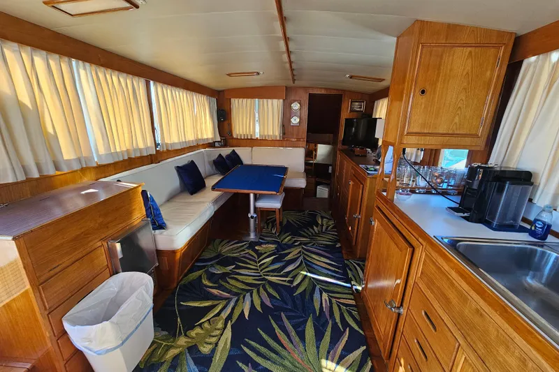 Slide: The Image of Interior of a 1978 Grand Banks 42 Classic yacht with wood finishes and cozy seating. - 16