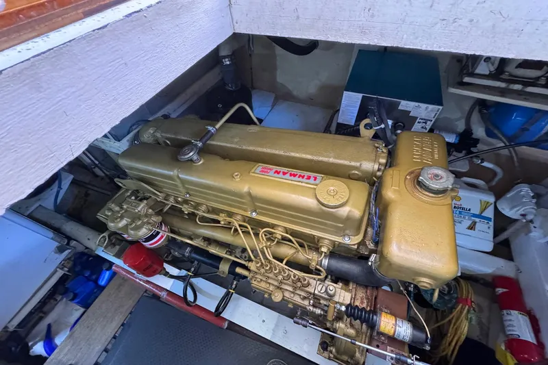 Slide: The Image of Engine compartment of a 1978 Grand Banks 42 Classic, featuring a Lehman engine. - 26