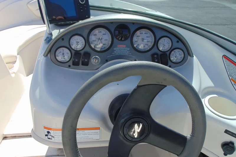 Slide: The Image of Steering wheel and dashboard of a 2007 Sea Ray 175 Sport boat. - 10