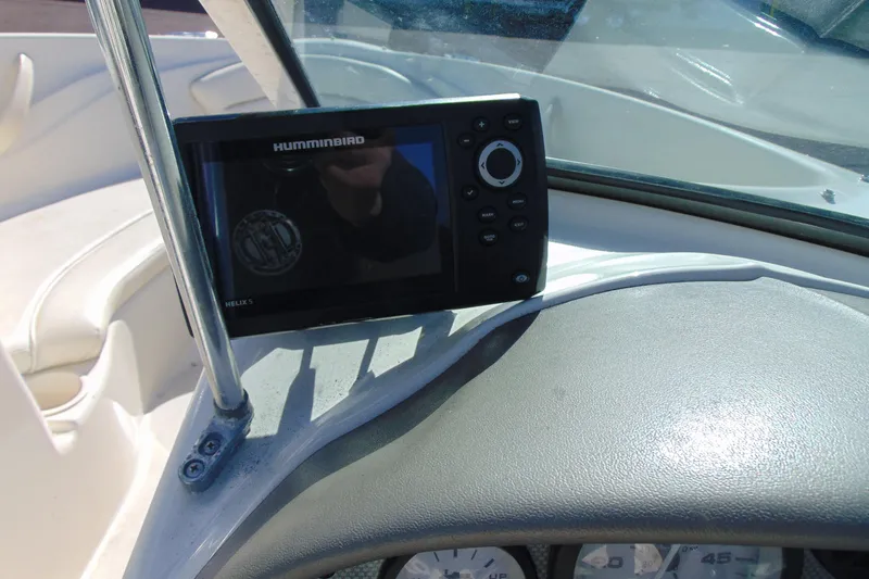 Slide: The Image of Humminbird Helix 5 fish finder on 2007 Sea Ray 175 Sport dashboard. - 11