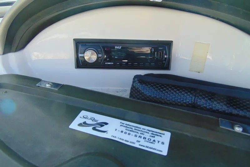 Slide: The Image of 2007 Sea Ray 175 Sport dashboard with Pyle stereo system and Sea Ray branding. - 12