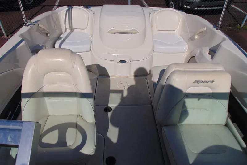 Slide: The Image of 2007 Sea Ray 175 Sport boat interior with white seating and steering wheel. - 14