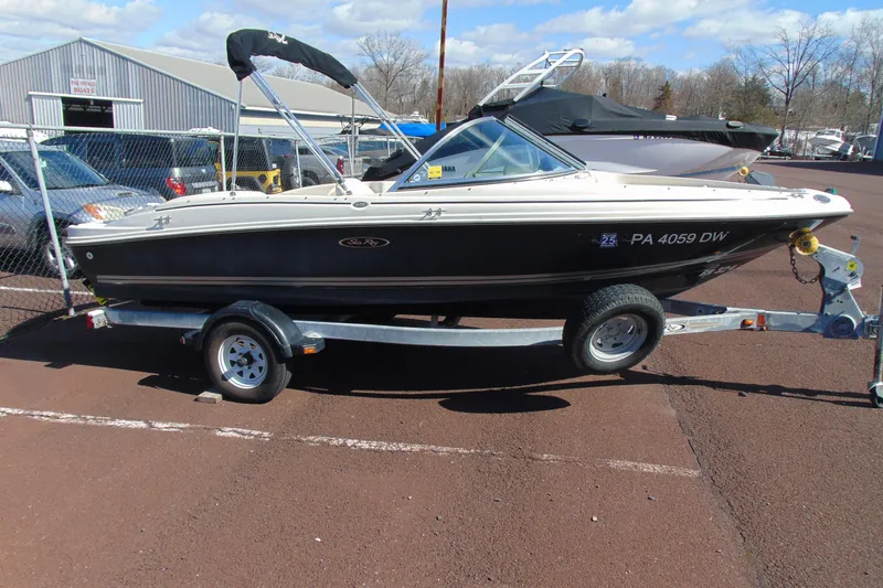 Slide: The Image of 2007 Sea Ray 175 Sport boat on trailer in outdoor lot. - 4