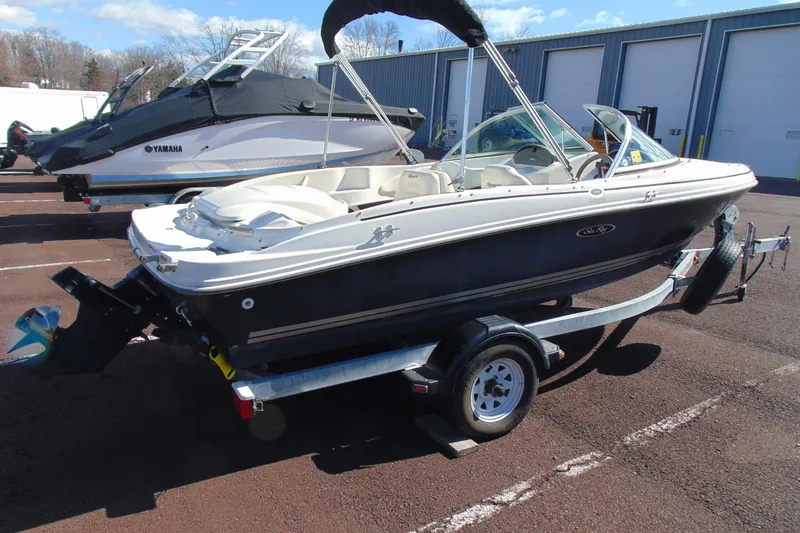 Slide: The Image of 2007 Sea Ray 175 Sport boat on trailer, parked outdoors. - 5