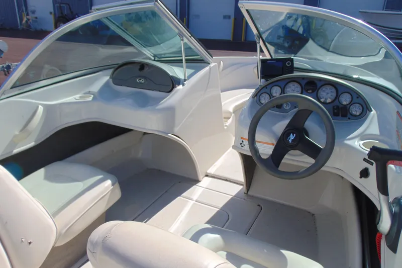 Slide: The Image of 2007 Sea Ray 175 Sport boat interior with steering wheel and dashboard gauges. - 8