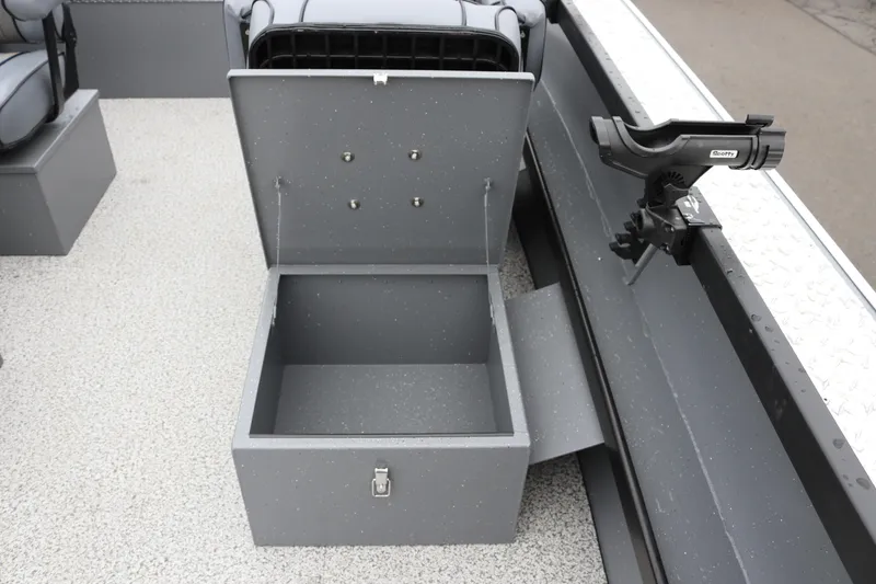 Slide: The Image of Open storage compartment on 2026 Alumaweld Columbia 23 boat with rod holder. - 11