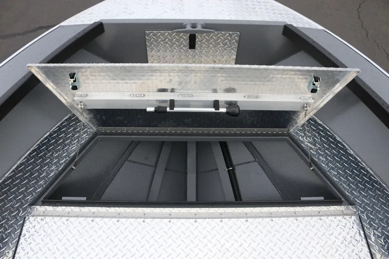 Slide: The Image of Open storage compartment on 2026 Alumaweld Columbia 23 boat with diamond plate finish. - 16