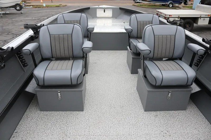Slide: The Image of 2026 Alumaweld Columbia 23 boat interior with four gray cushioned seats. - 2