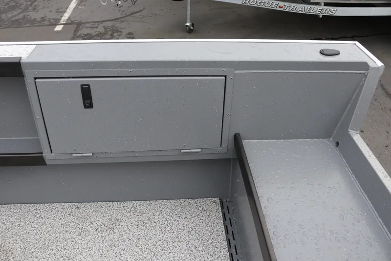 Slide: The Image of 2026 Alumaweld Columbia 23 boat interior with storage compartment and textured flooring. - 20