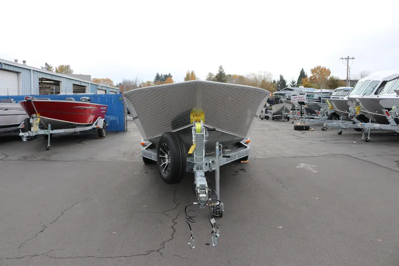 Slide: The Image of 2026 Alumaweld Columbia 23 boat on trailer in outdoor showroom. - 26