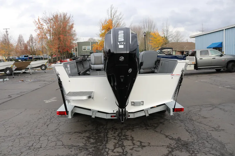 Slide: The Image of 2026 Alumaweld Columbia 23 boat with powerful V6 engine, parked outdoors. - 30