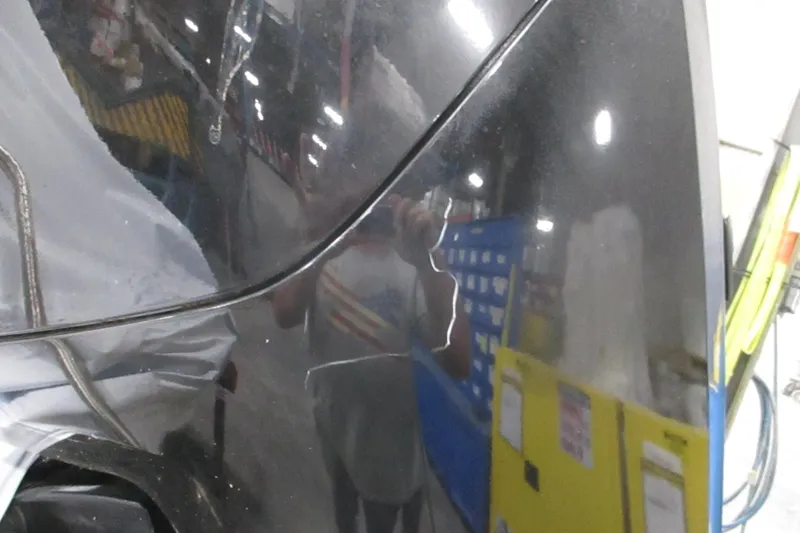 Slide: The Image of Reflection on a 2025 Tahoe T18 vehicle in a garage setting. - 7