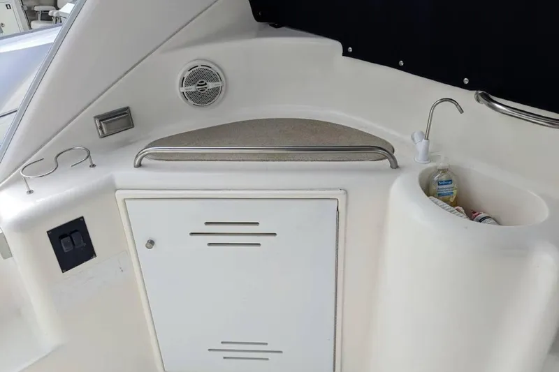 Slide: The Image of 2003 Cruisers 3970 yacht kitchenette with sink, storage, and speaker. - 17