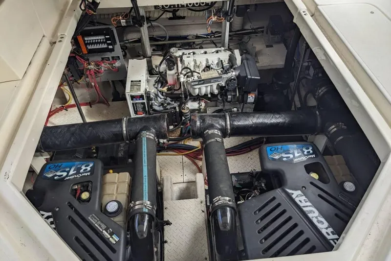 Slide: The Image of Engine compartment of a 2003 Cruisers 3970 boat with dual Mercury 8.1S motors. - 19