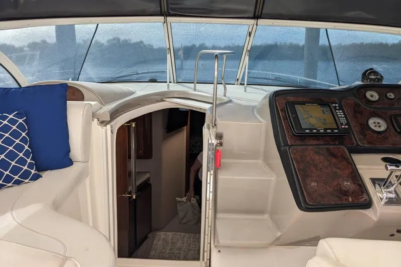 Slide: The Image of Interior view of 2003 Cruisers 3970 yacht cockpit with navigation system and seating. - 7