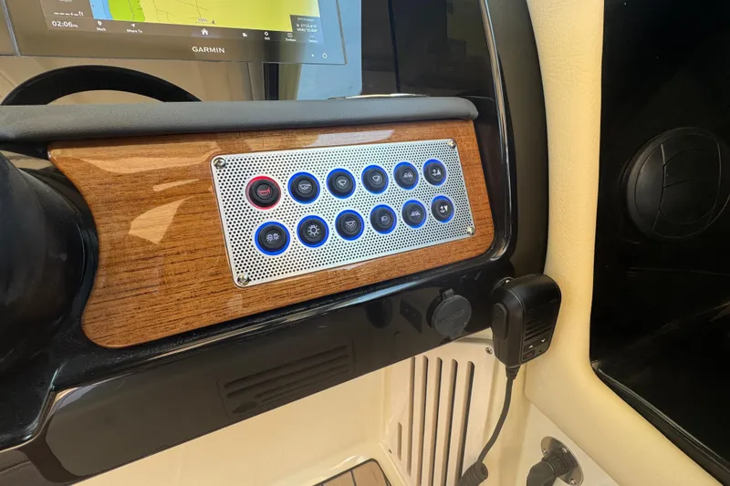 Slide: The Image of Dashboard of 2026 Chris-Craft Calypso 32 with control panel and Garmin display. - 11