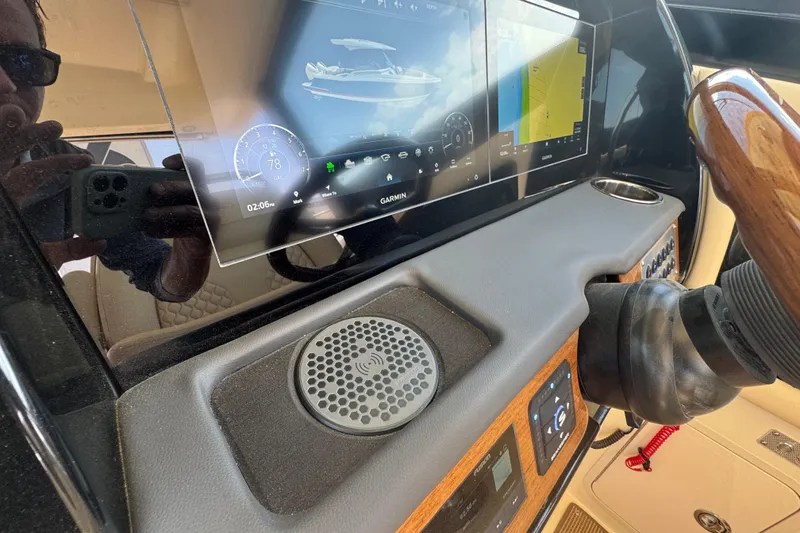 Slide: The Image of Dashboard of 2026 Chris-Craft Calypso 32 with advanced navigation display. - 13