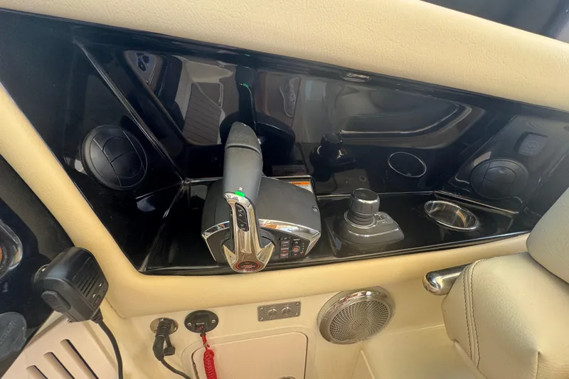 Slide: The Image of Control panel of 2026 Chris-Craft Calypso 32 boat with throttle and joystick. - 14