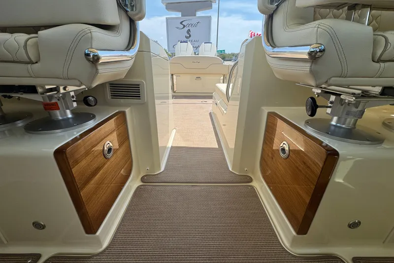 Slide: The Image of Interior view of 2026 Chris-Craft Calypso 32 boat, featuring luxurious seating and wooden accents. - 15