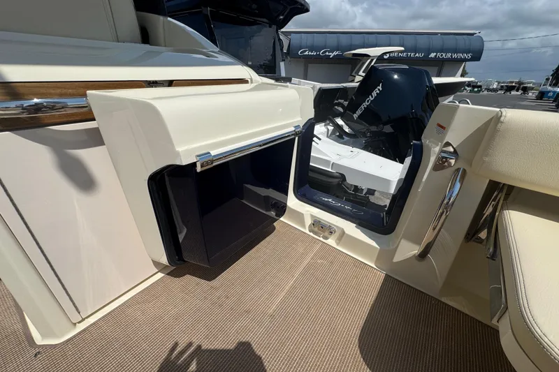 Slide: The Image of 2026 Chris-Craft Calypso 32 boat interior with Mercury engine, showcasing sleek design and luxury features. - 22