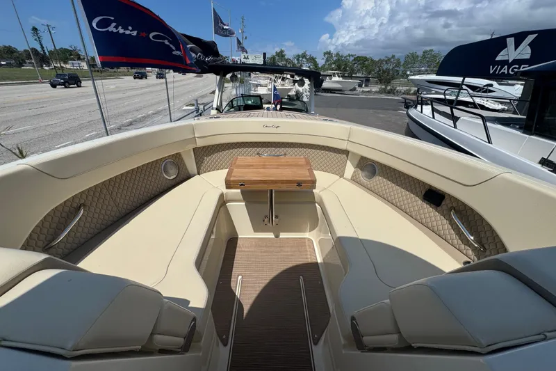 Slide: The Image of 2026 Chris-Craft Calypso 32 boat interior with luxurious seating and wooden table. - 29