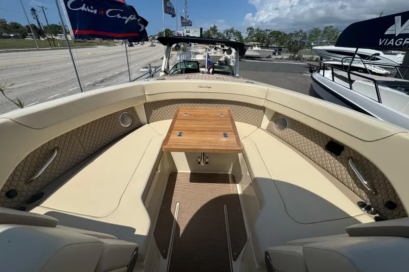 Slide: The Image of 2026 Chris-Craft Calypso 32 boat interior with seating and wooden table. - 30