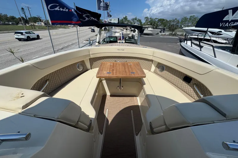 Slide: The Image of 2026 Chris-Craft Calypso 32 boat interior with seating and wooden table. - 31