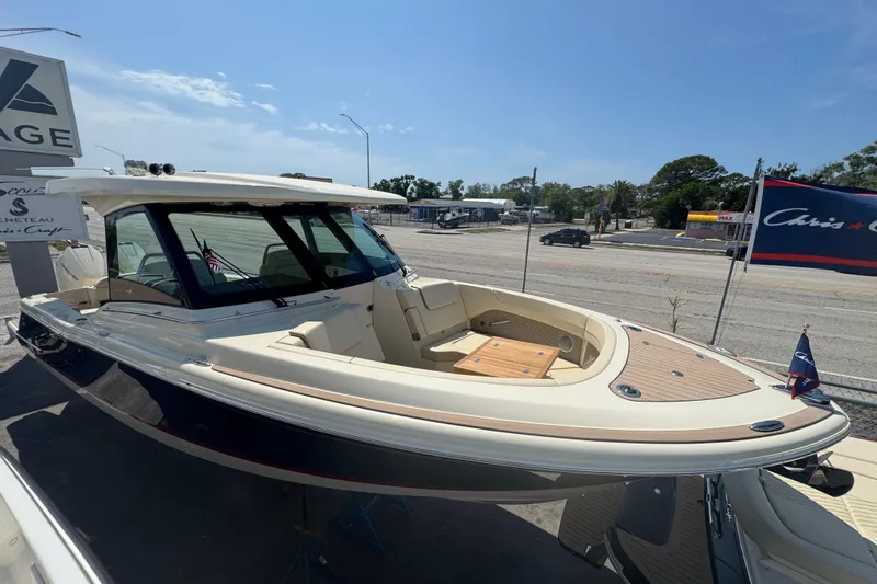 Slide: The Image of 2026 Chris-Craft Calypso 32 boat displayed outdoors on a sunny day. - 35