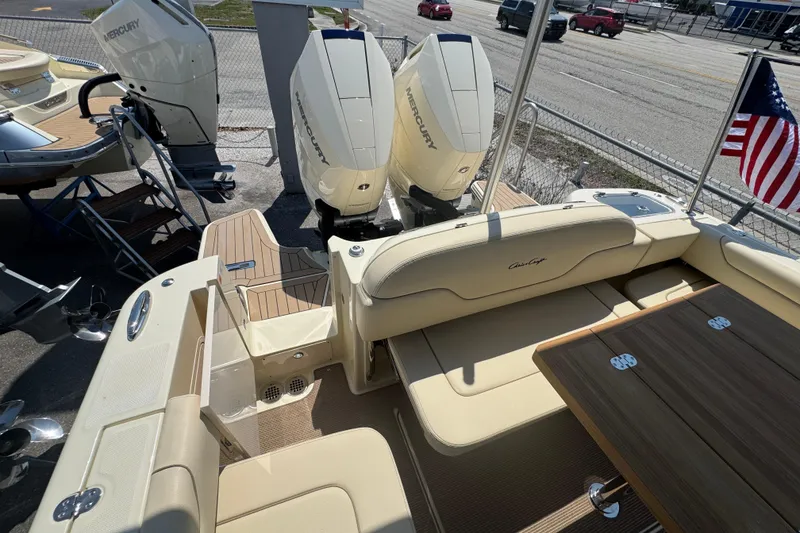 Slide: The Image of 2026 Chris-Craft Calypso 32 boat with twin Mercury engines and American flag. - 45