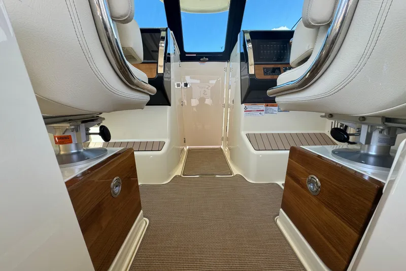 Slide: The Image of 2026 Chris-Craft Calypso 32 interior with luxurious seating and modern dashboard. - 48
