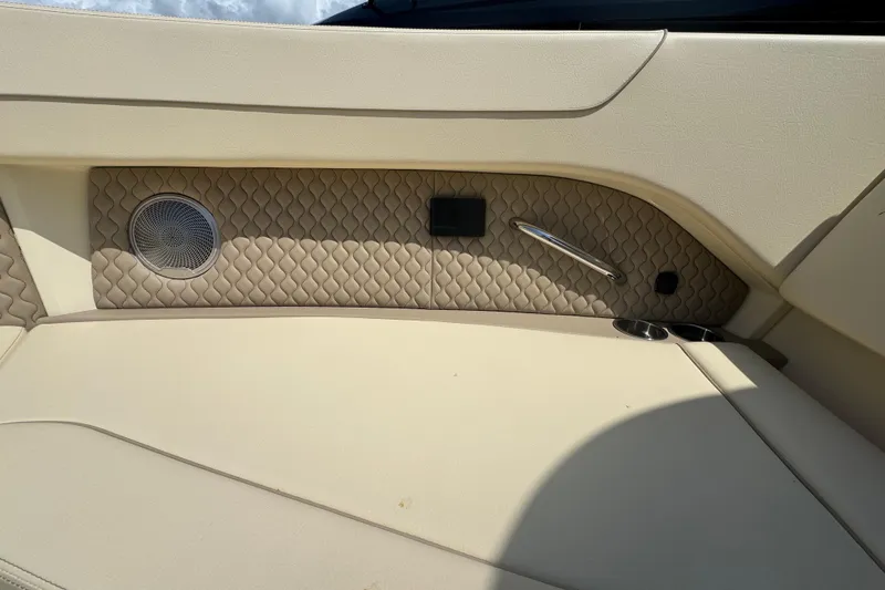 Slide: The Image of Interior of 2026 Chris-Craft Calypso 32 boat with quilted paneling and speaker. - 5