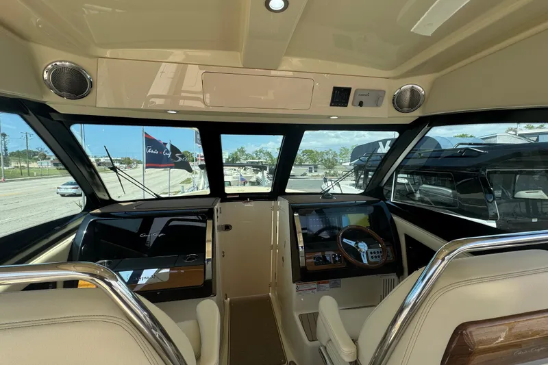 Slide: The Image of Interior view of 2026 Chris-Craft Calypso 32 boat cockpit with modern controls. - 50