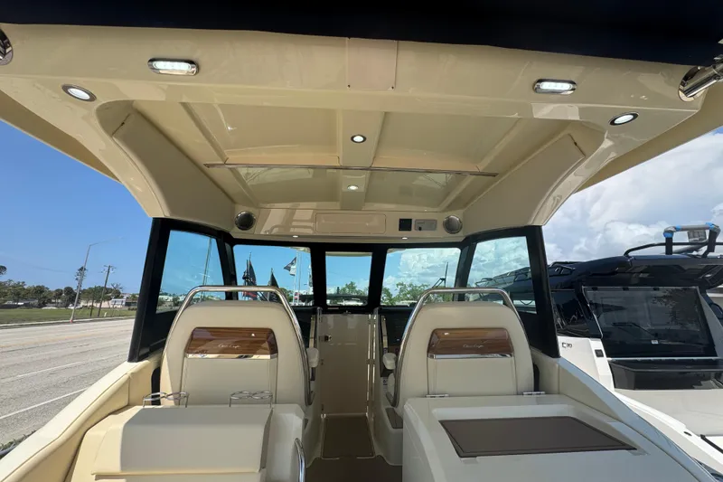 Slide: The Image of Interior view of 2026 Chris-Craft Calypso 32 boat, showcasing luxurious seating and modern design. - 51