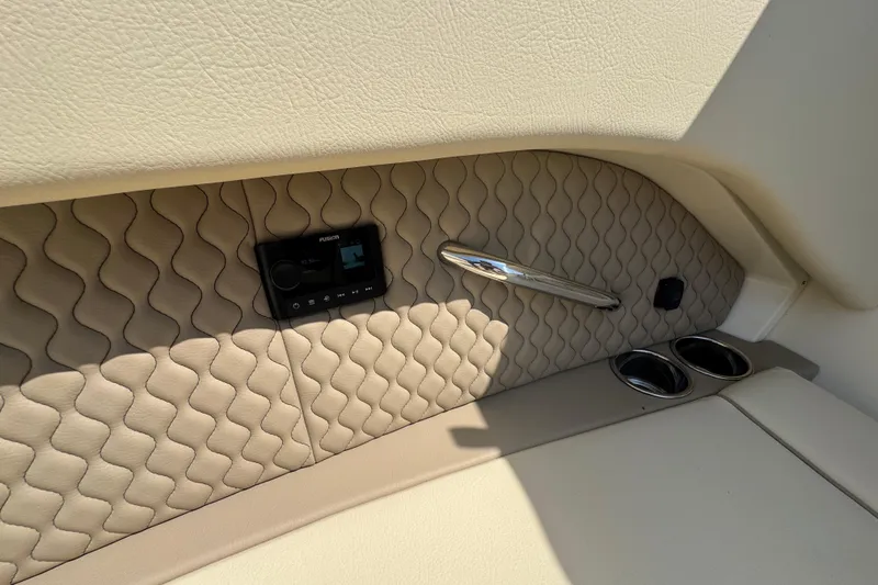 Slide: The Image of Luxurious interior of 2026 Chris-Craft Calypso 32 with quilted leather and modern controls. - 56