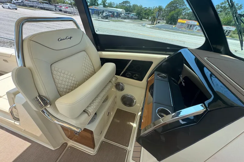 Slide: The Image of Luxurious interior of 2026 Chris-Craft Calypso 32 boat with elegant seating and dashboard. - 8