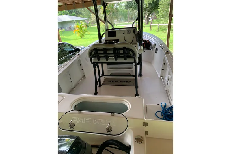 Slide: The Image of 2018 Sea Pro 219 Center Console boat under wooden shelter, interior view. - 3