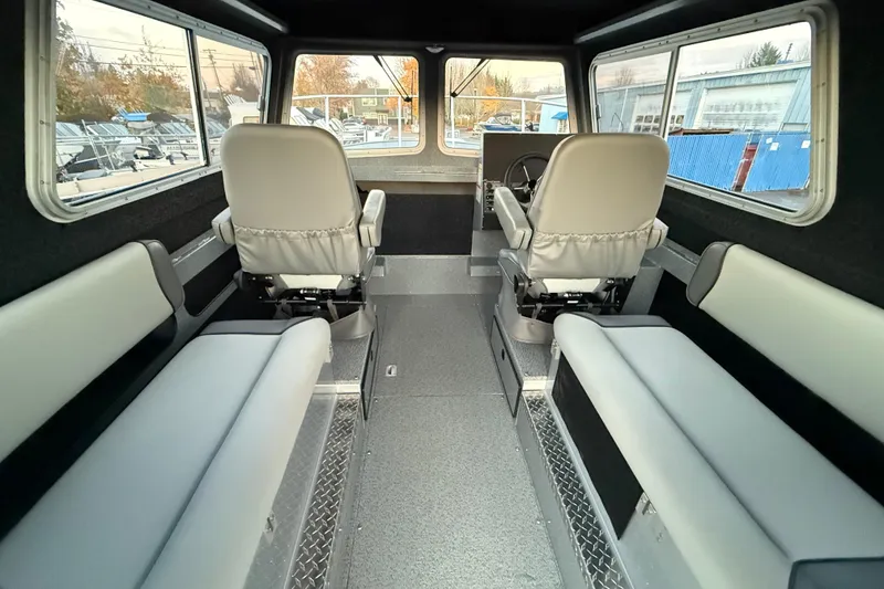Slide: The Image of Interior of 2026 KingFisher 2625 Coastal Express boat with seating and steering console. - 15